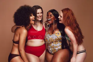 Different size females in bikinis laughing together