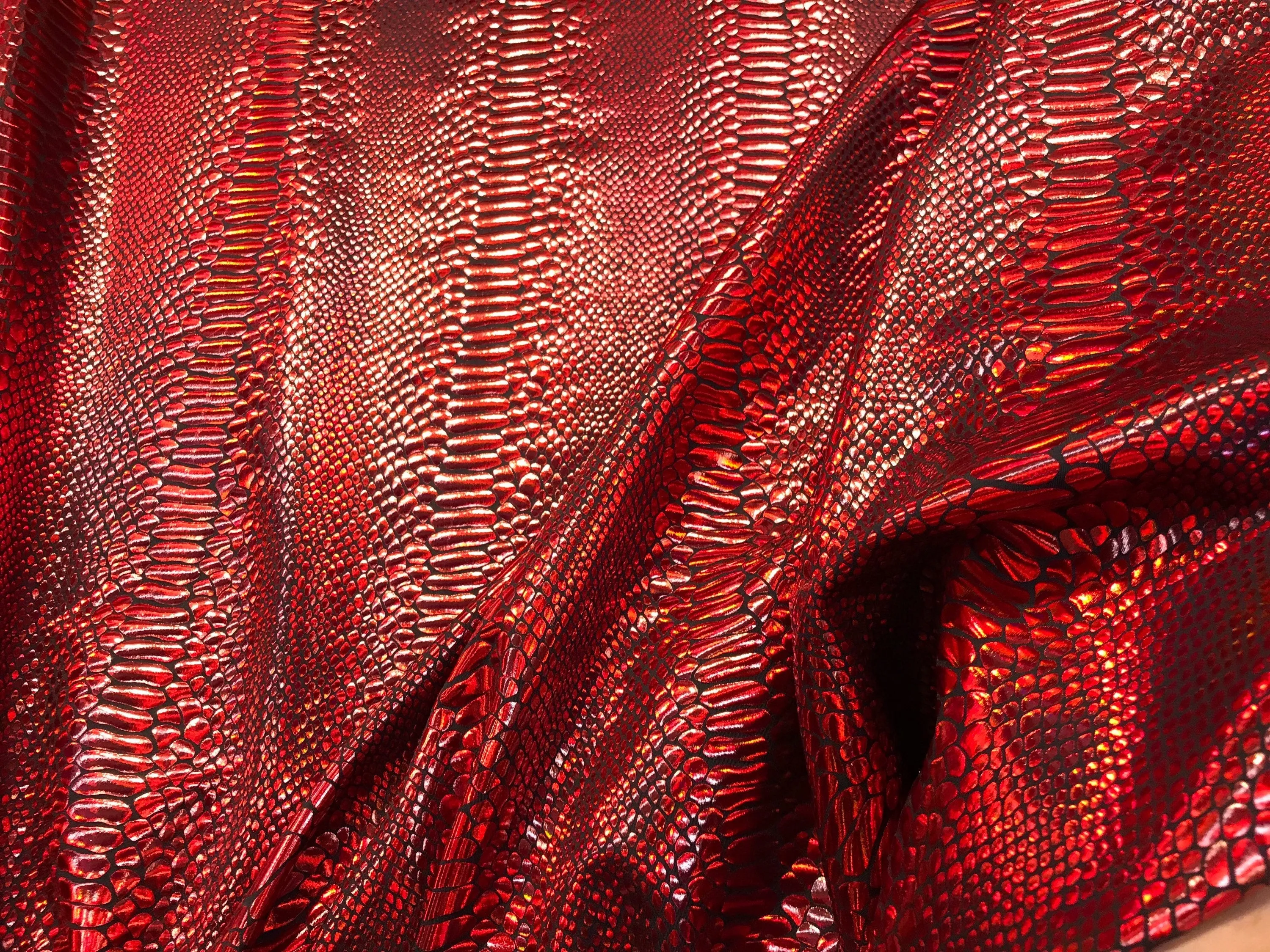 Red iridescent snake skin print on a 2 way stretch nylon spandex-skirts-leggings-dresses-decorations-nightgown-sold by the yard.