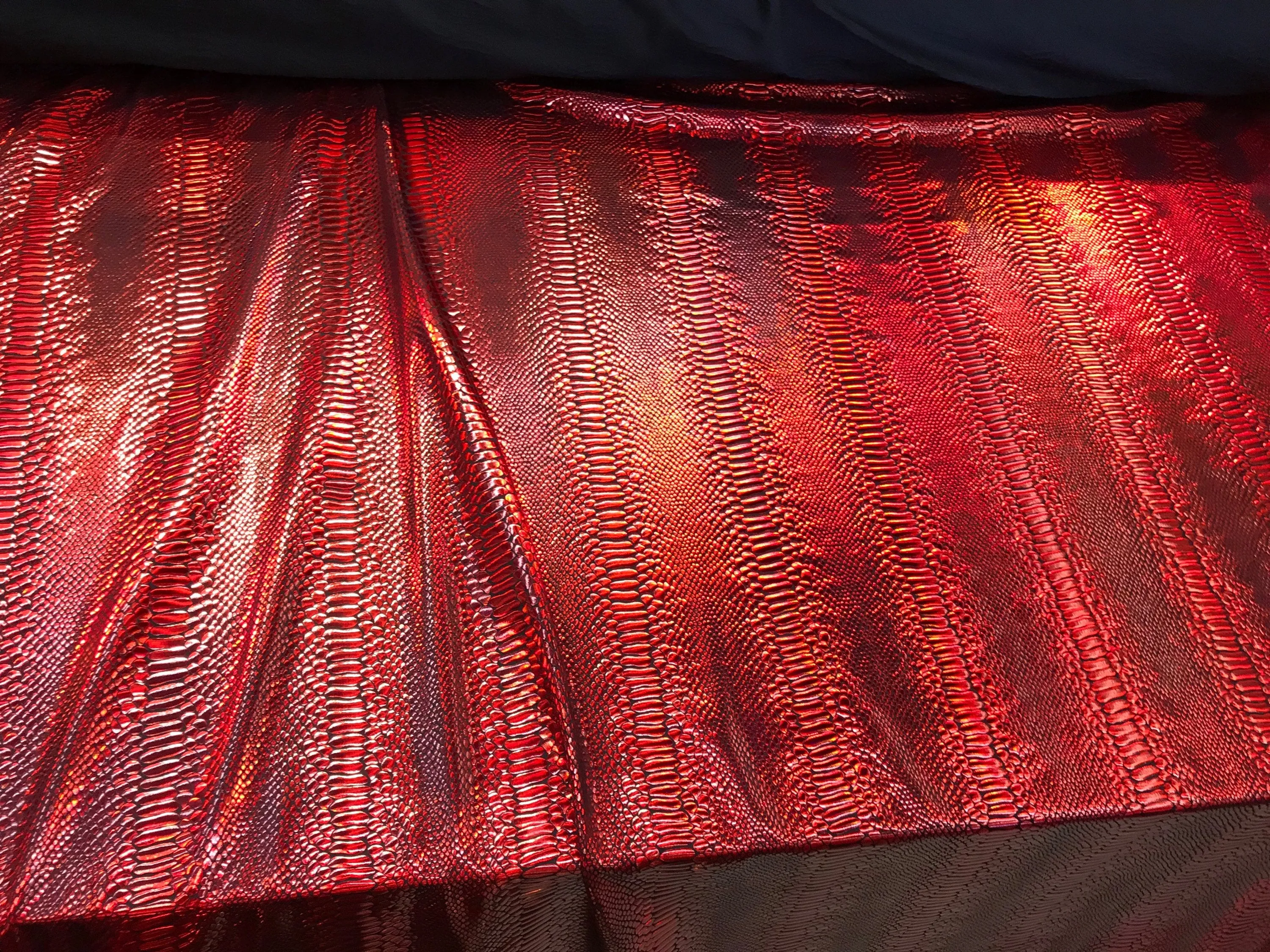 Red iridescent snake skin print on a 2 way stretch nylon spandex-skirts-leggings-dresses-decorations-nightgown-sold by the yard.