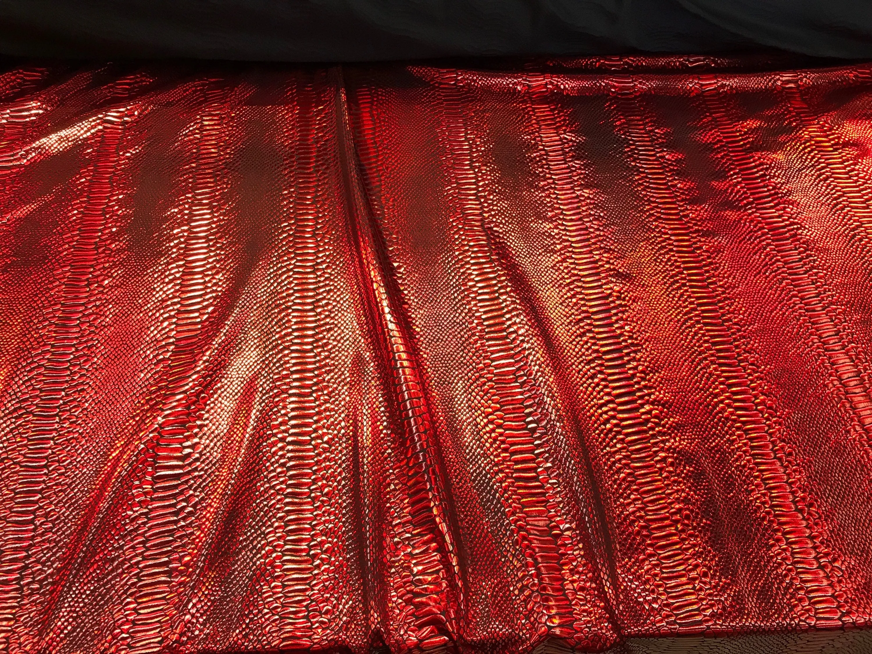 Red iridescent snake skin print on a 2 way stretch nylon spandex-skirts-leggings-dresses-decorations-nightgown-sold by the yard.