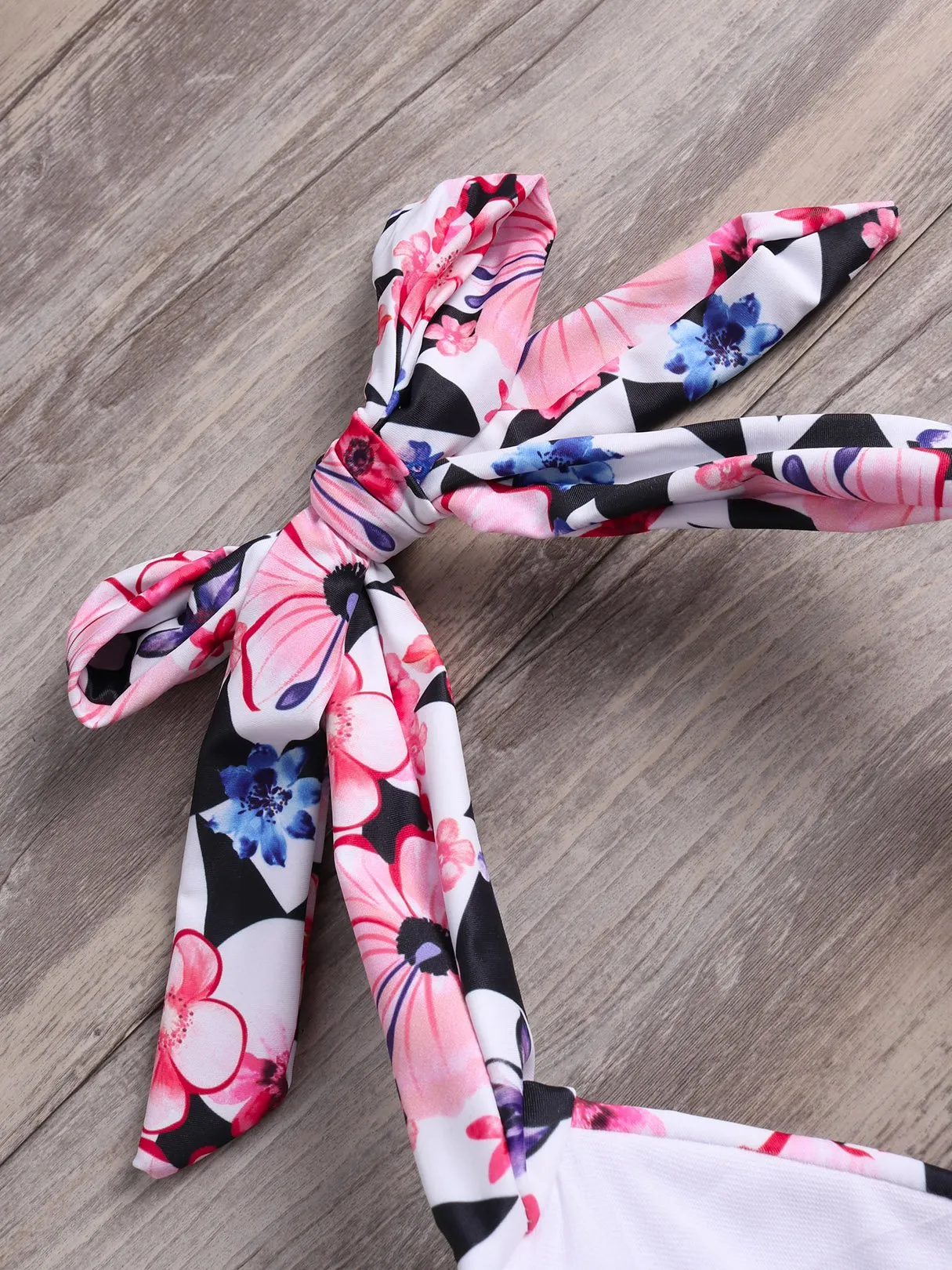 Wholesale Purple Halter Sleeveless Floral Print Cut Out Tie-Up High-Waisted Bikini Suits